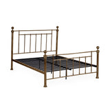 Gold metal bed frame without mattress, showing metal slats and vertical spindles on white background