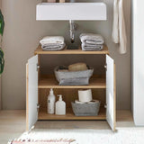 Wood and white bathroom storage cabinet under sink with towels baskets and toiletries