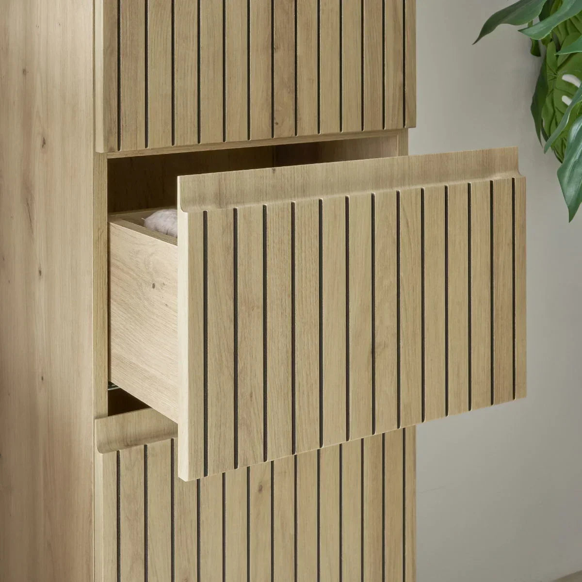 Detail of Austin highboard with slatted wood drawer partially open, showing natural finish