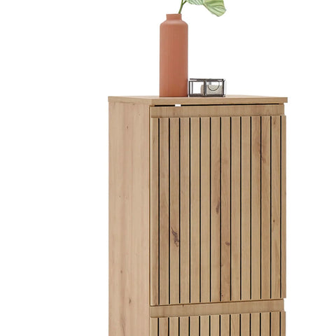 Oak wood cabinet with vertical slat doors and decorative vase on top
