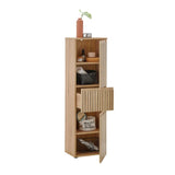 Tall oak storage cabinet with slatted doors and shelves, styled with decor and baskets
