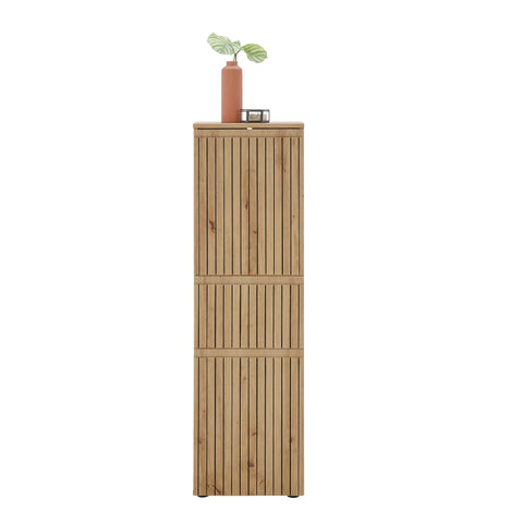 Tall wooden storage cabinet with slatted doors, decorated with a vase and plant on top