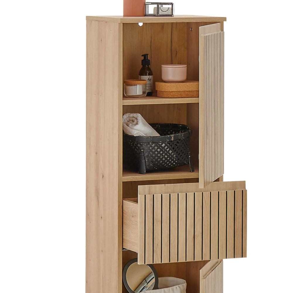 Tall oak shelving unit with vertical slat doors, open shelves and visible bathroom storage
