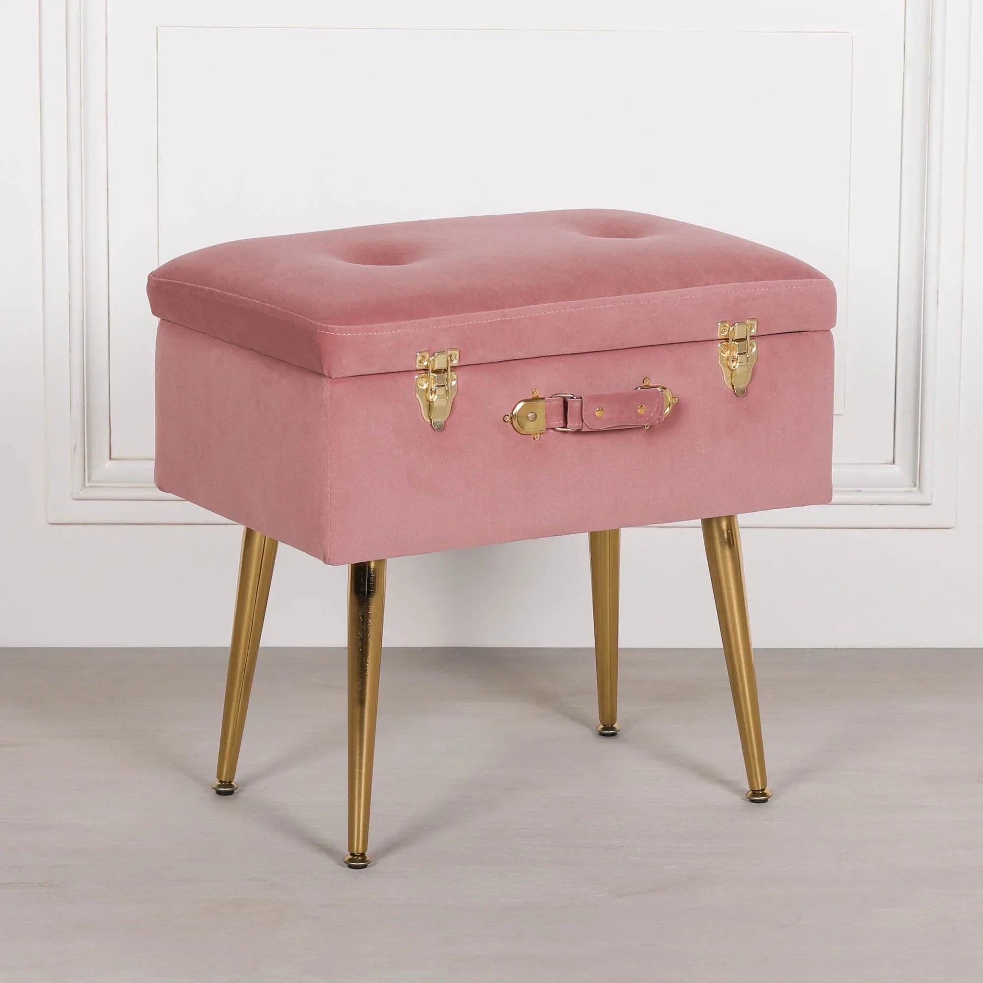 Pink velvet storage ottoman with gold metal legs and brass latch details