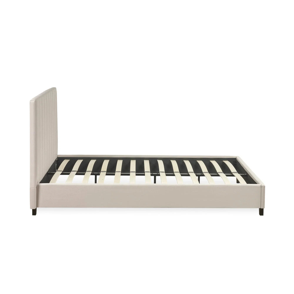 Beige upholstered bed frame with vertical stitched headboard and wooden slats, side view