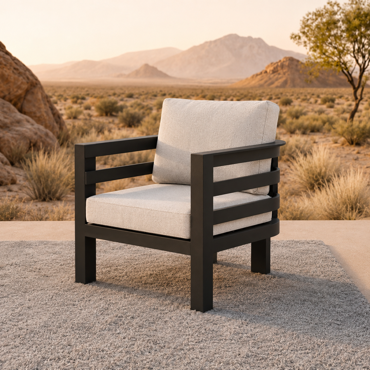 Beige textured cushions with black metal frame chair on grey rug in desert setting