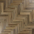 Antique walnut wood flooring in herringbone pattern with natural grain detail
