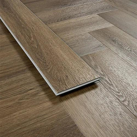 Antique walnut wood flooring plank showing grain pattern and herringbone installation
