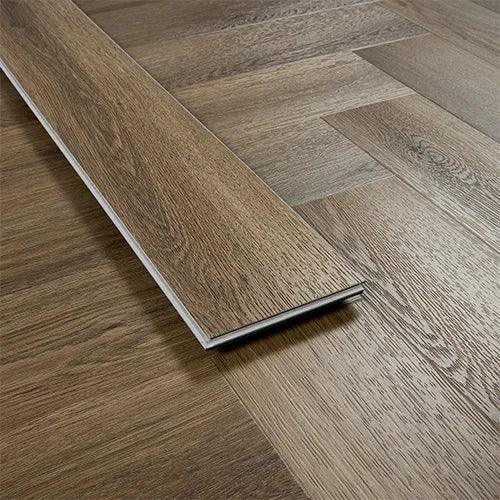 Antique walnut wood flooring plank showing grain pattern and herringbone installation