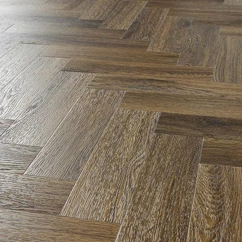 Antique walnut herringbone wood flooring close up with natural grain detail