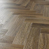 Antique walnut herringbone wood flooring close up with natural grain detail