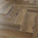 Antique walnut herringbone flooring with natural wood grain texture and brown color variation