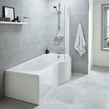 Modern bathroom with a white bathtub against a gray tiled wall.