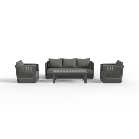 Dark grey fabric cushions with matching woven and metal frame seating set and slatted table.