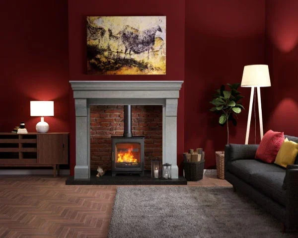 Contemporary living room with wood burner fireplace, grey sofa, and modern decor