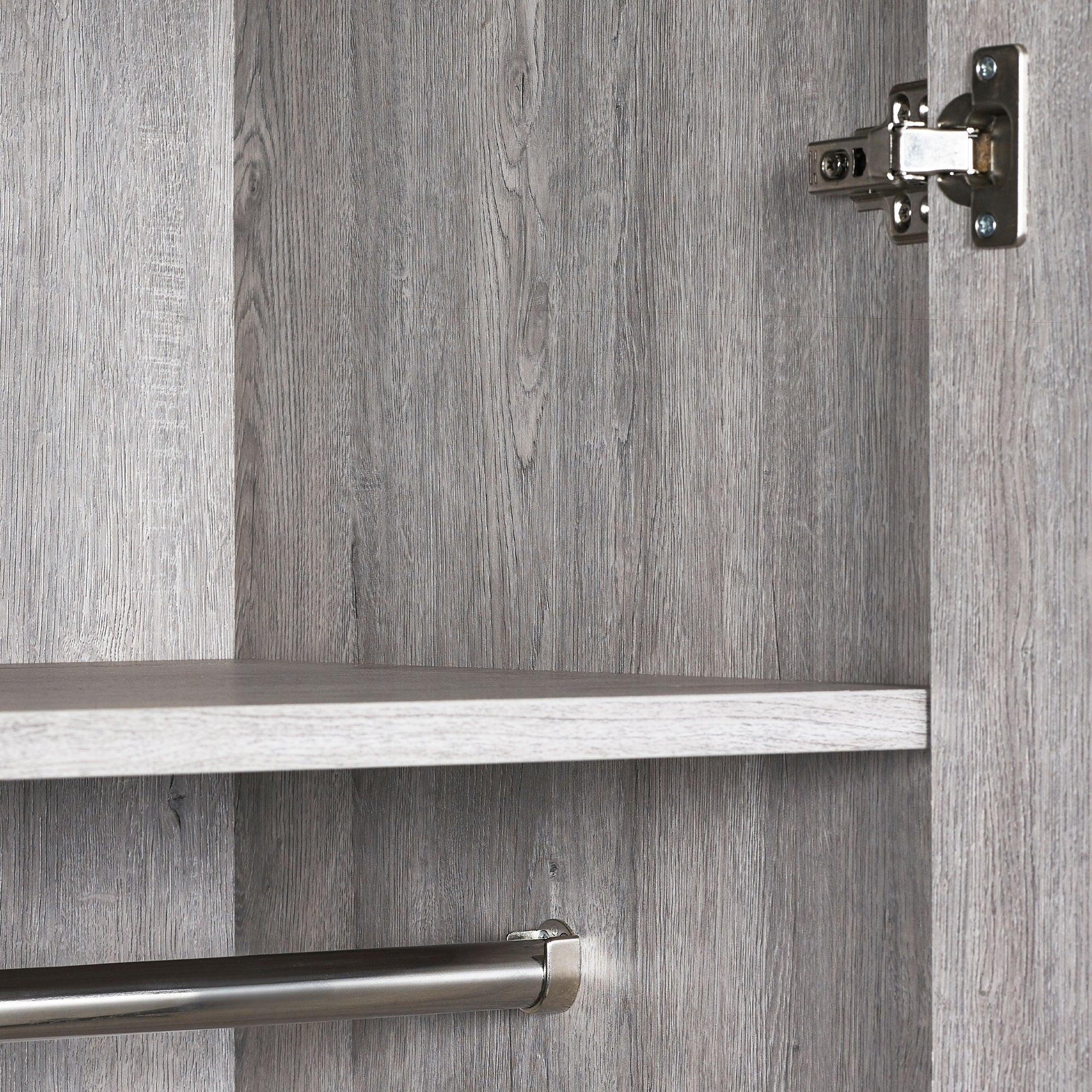 Grey wood wardrobe interior with shelf, metal hanging rail and door hinge detail