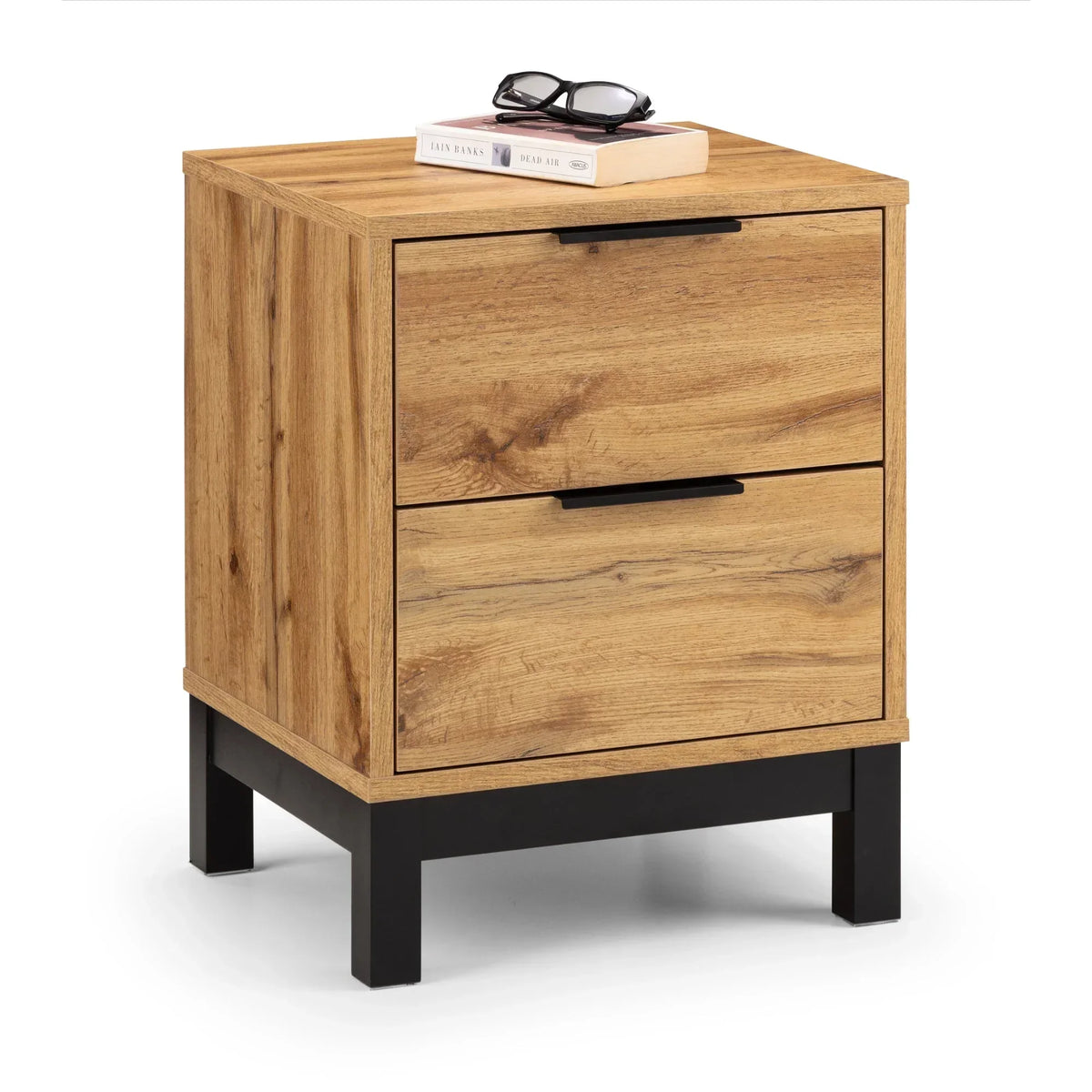 Oak effect bedside table with two drawers, black handles and metal legs, books on top