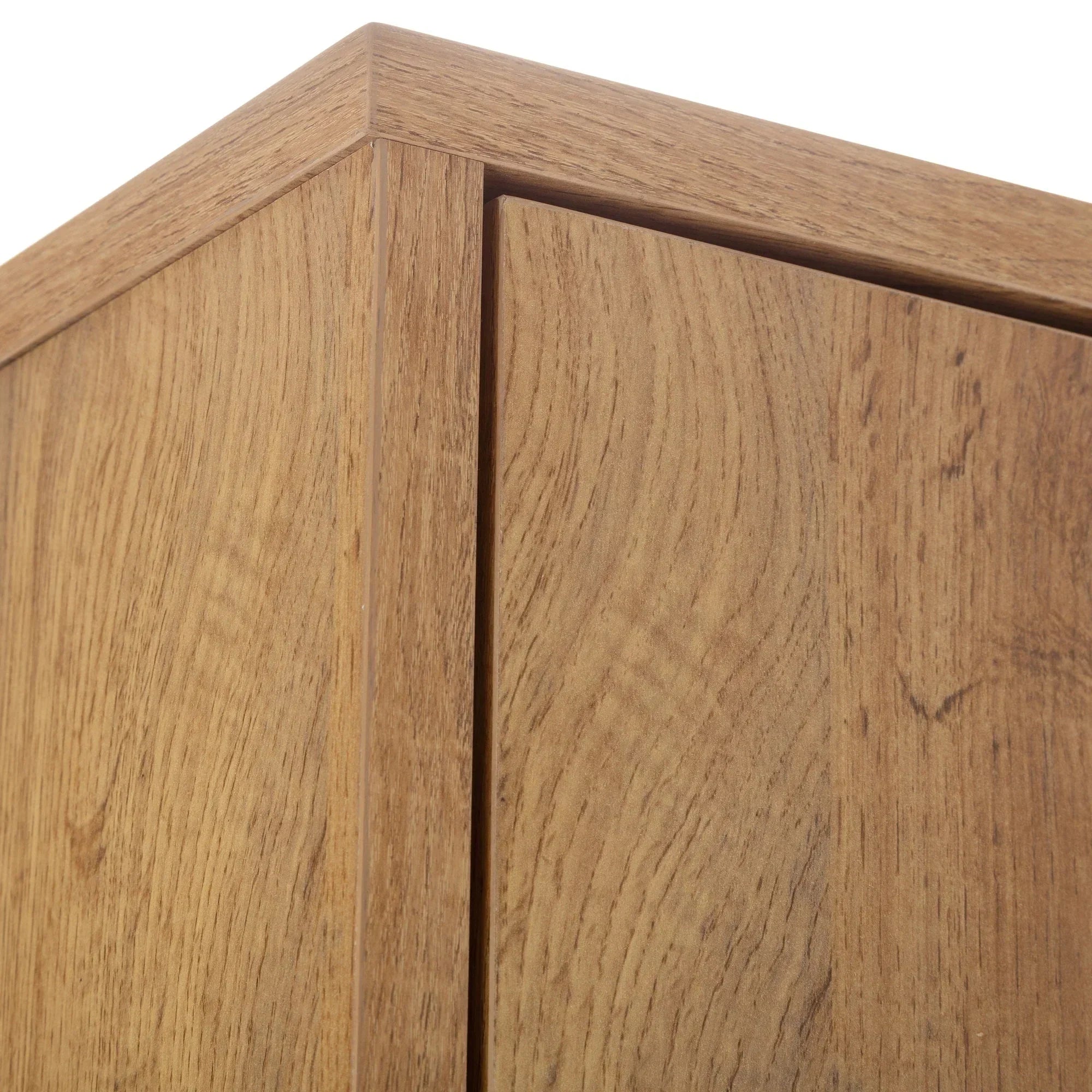 Close up of oak effect wardrobe corner showing wood grain texture and smooth panel join