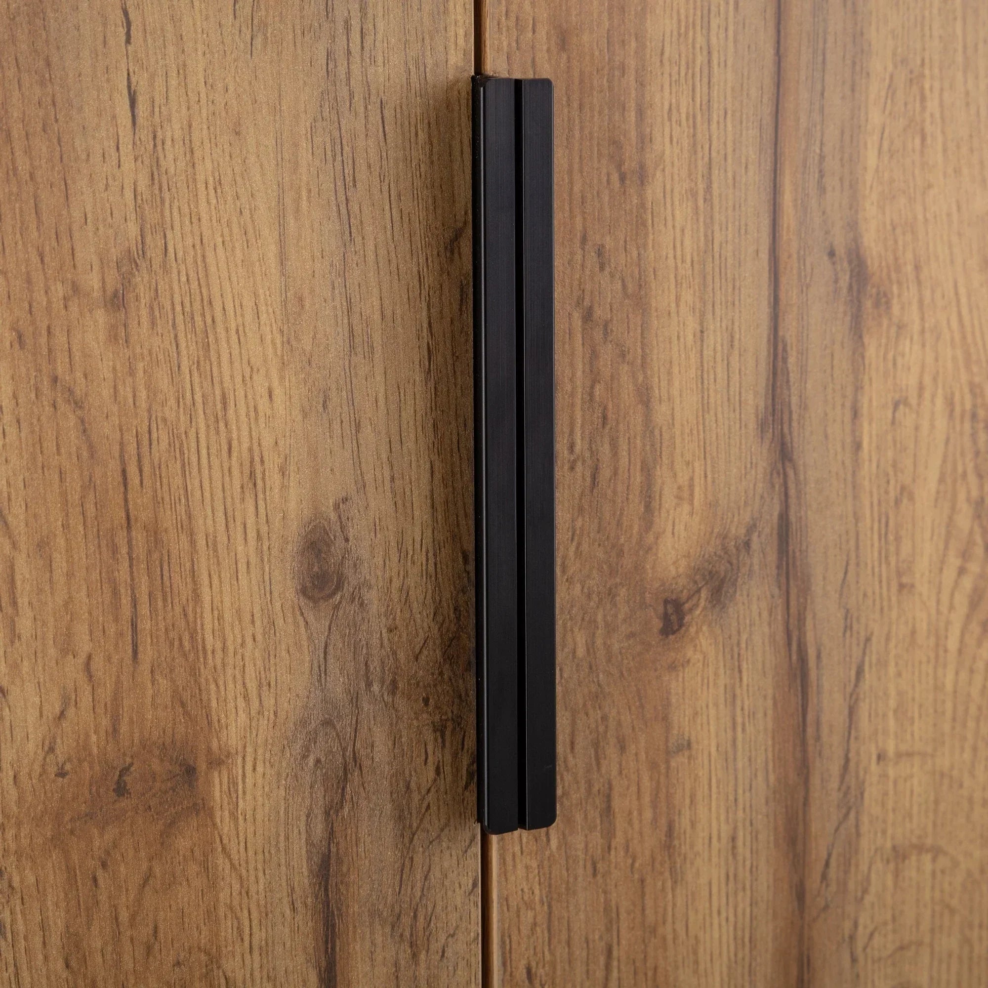 Bali two door wardrobe closeup showing wood grain finish and black metal handle detail