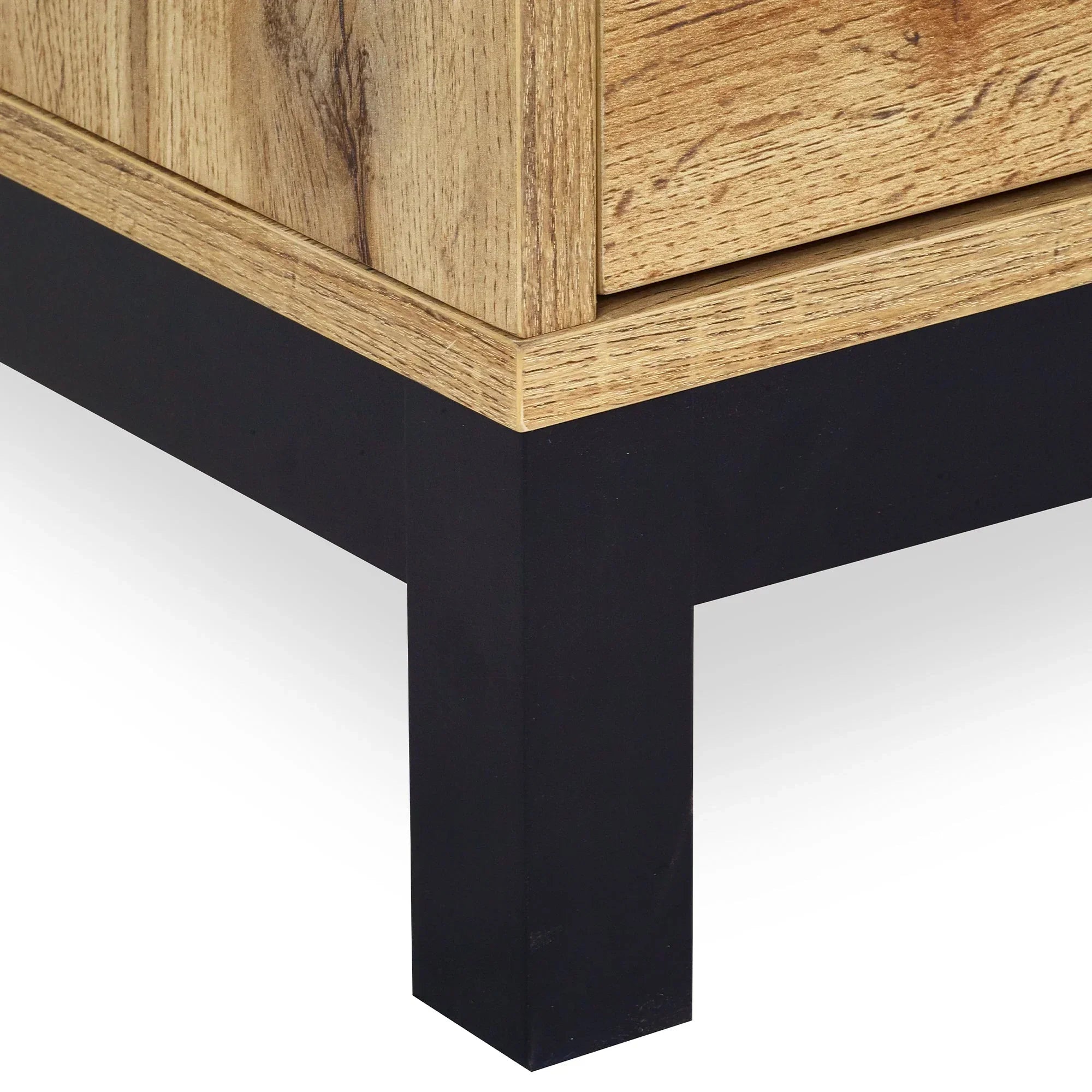 Light oak TV unit corner with black metal leg close-up