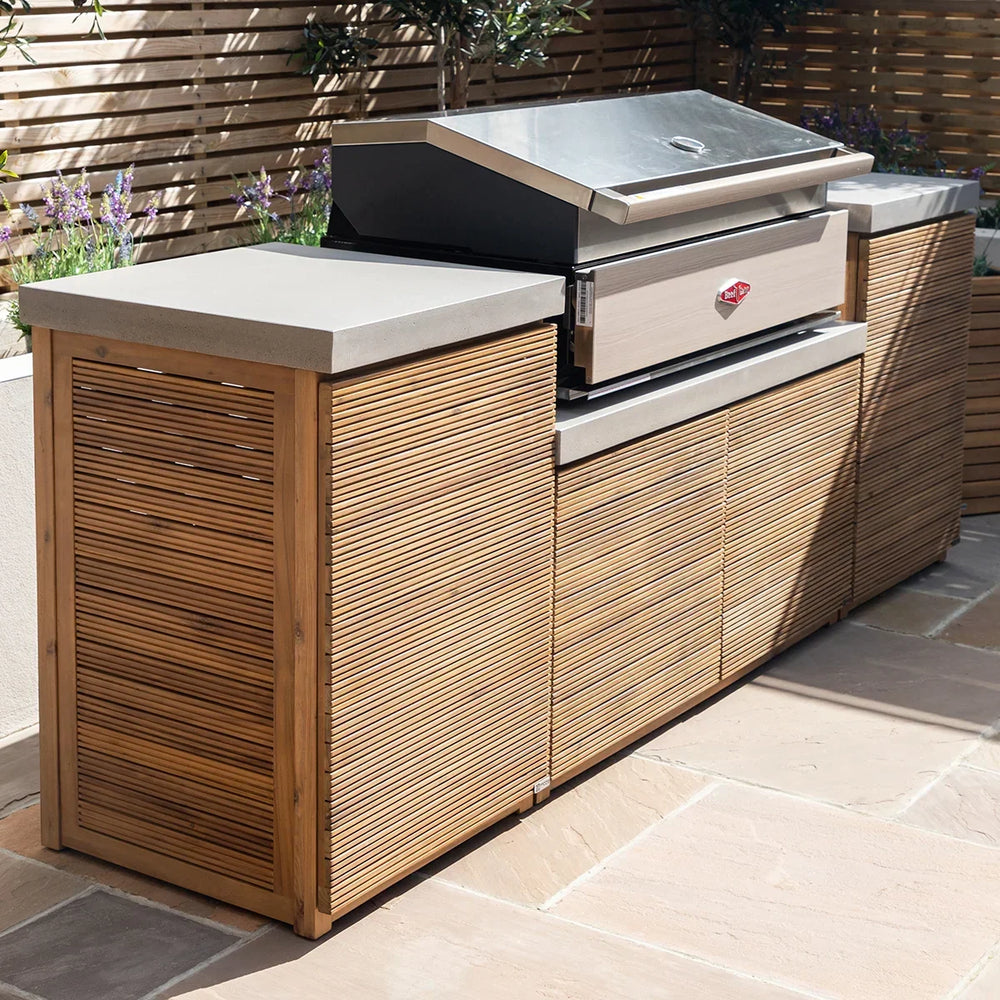 Outdoor kitchen unit with wood slat cabinets, stone countertop and built-in barbecue grill