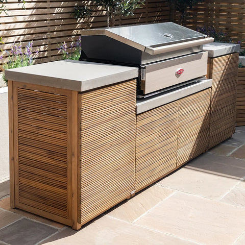 Outdoor kitchen unit with wood slat cabinets, stone countertop and built-in barbecue grill