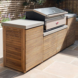Outdoor kitchen unit with wood slat cabinets, stone countertop and built-in barbecue grill