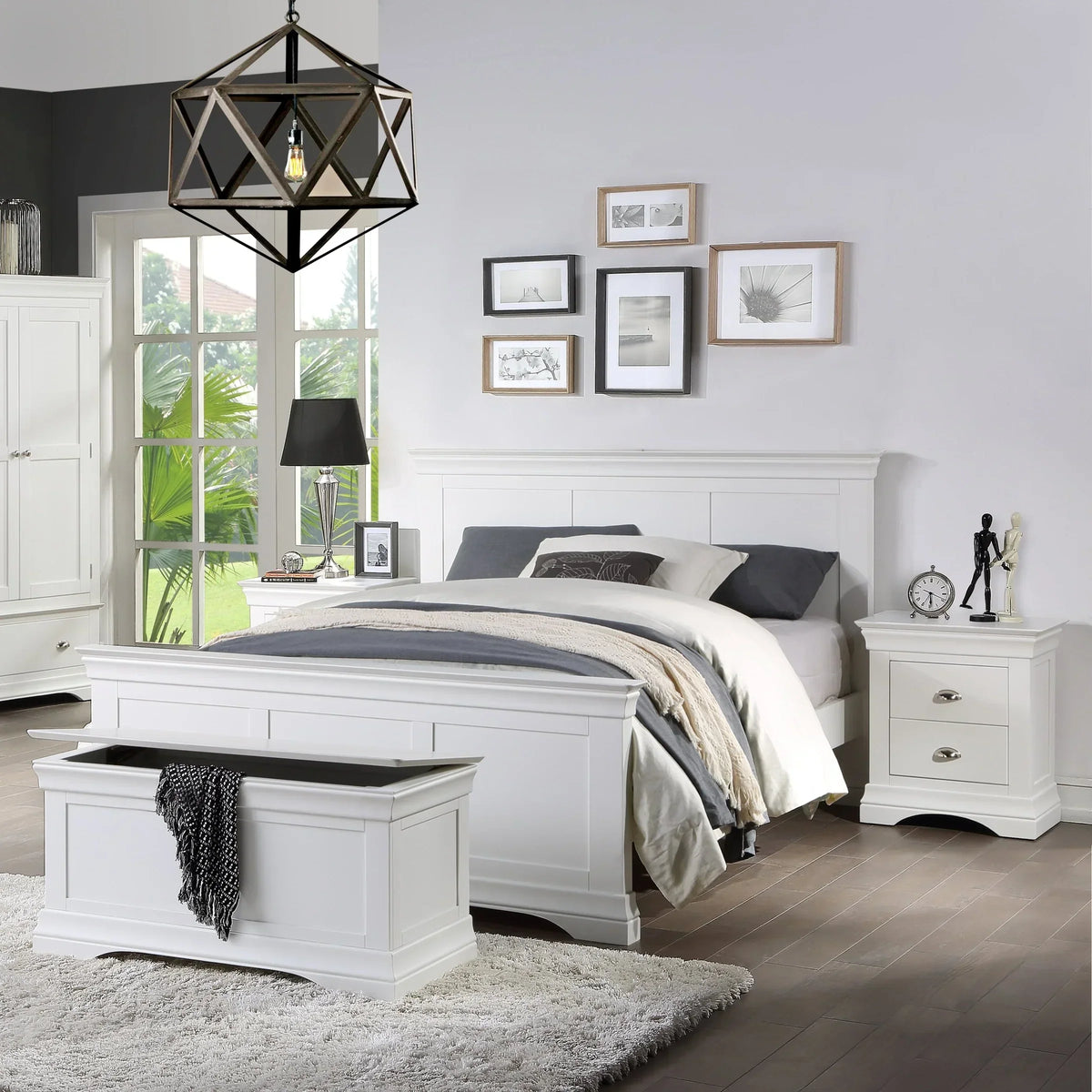White wooden bed frame with matching bedside table and storage bench in modern bedroom