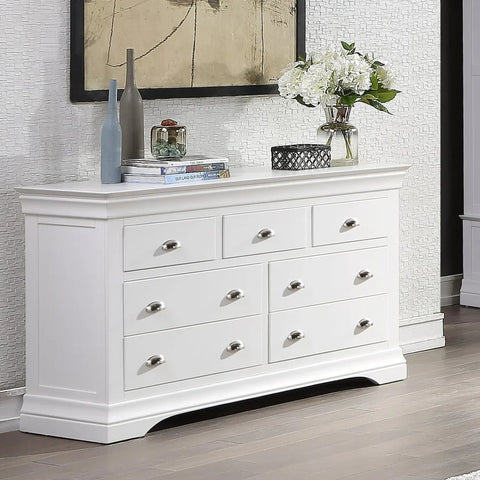 White chest of drawers with silver handles in modern living room setting