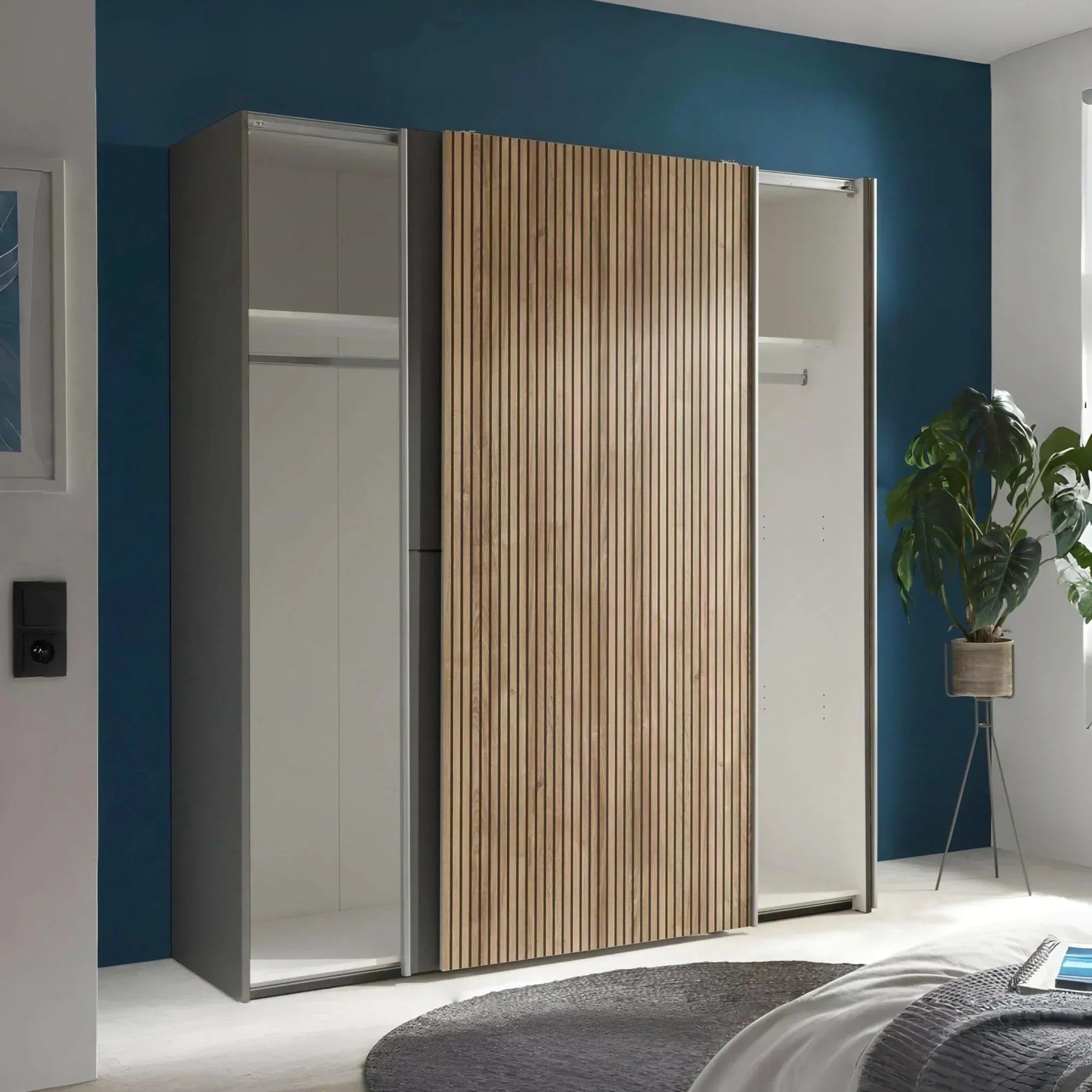 Sliding door wardrobe with wood panel design and mirrored section in modern bedroom