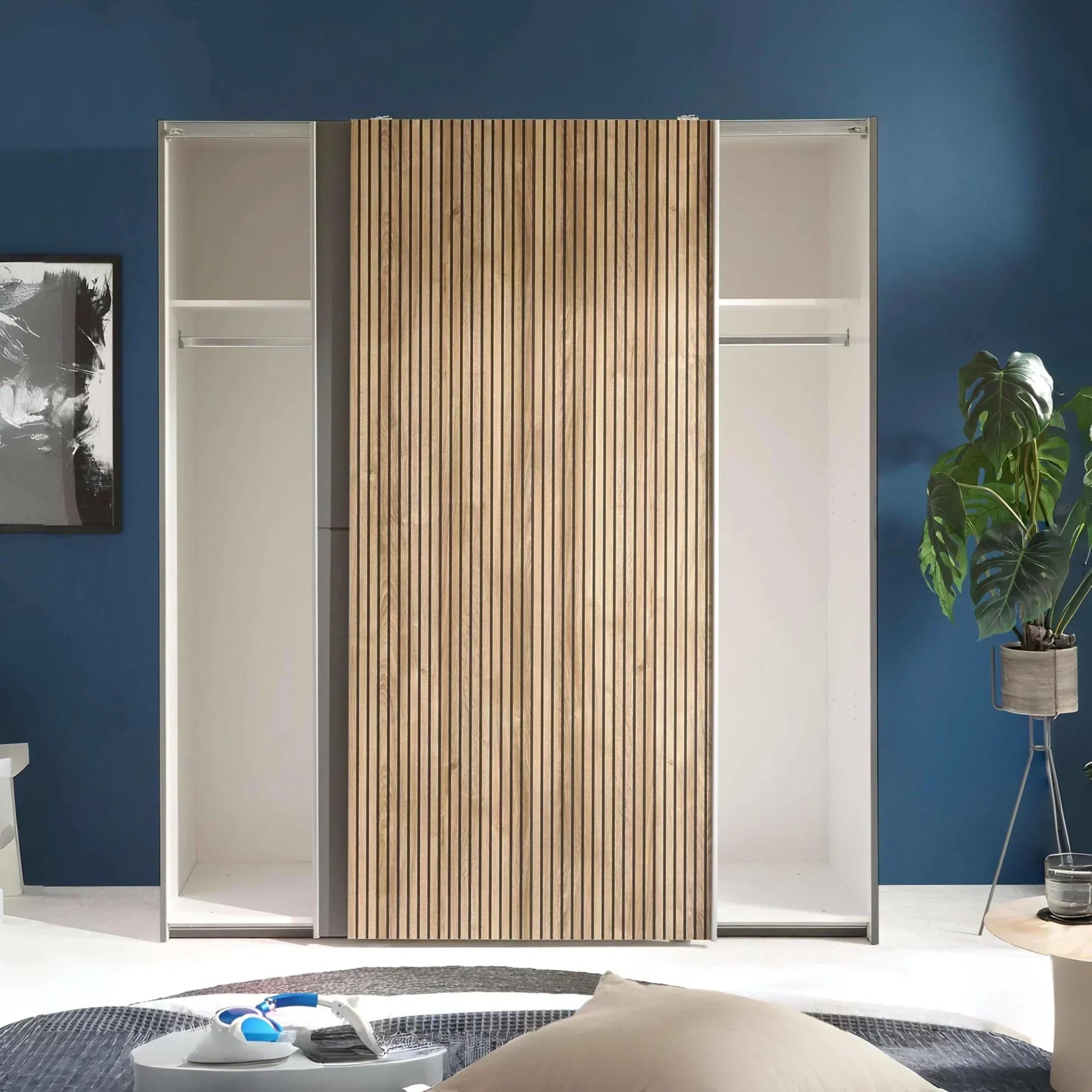 Modern wardrobe with sliding wood slat door and open shelves in stylish bedroom setting