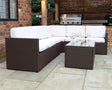 Brown rattan outdoor corner sofa set with cream cushions and glass coffee table on patio