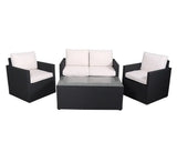 Black rattan patio sofa set with cream cushions and glass-topped coffee table