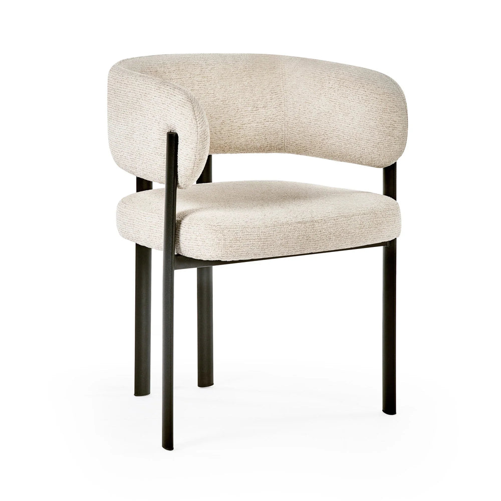 Cream fabric accent chair with curved backrest and black metal legs, angled view