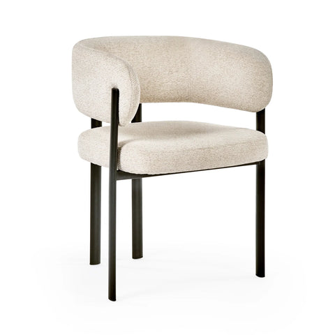 Cream fabric accent chair with curved backrest and black metal legs, angled view
