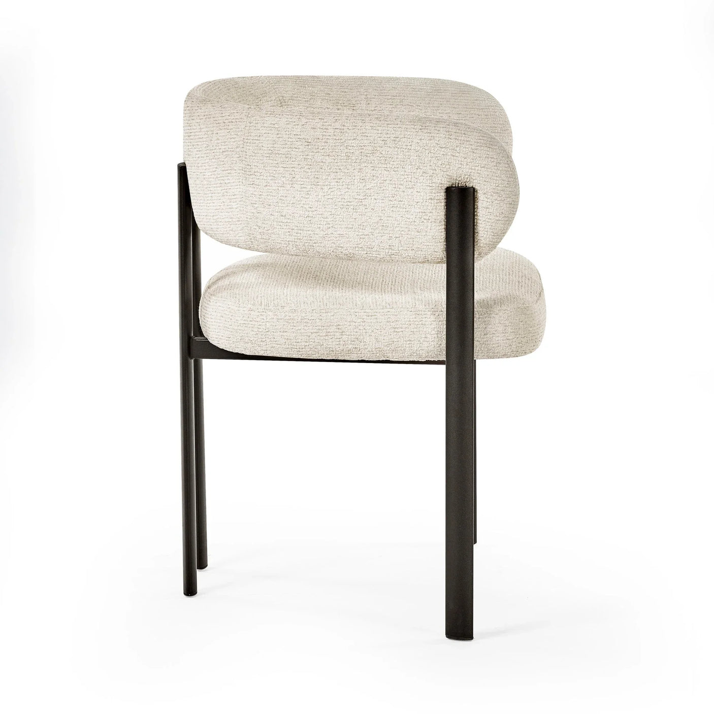 Modern beige fabric dining chair with black metal legs, side angle view