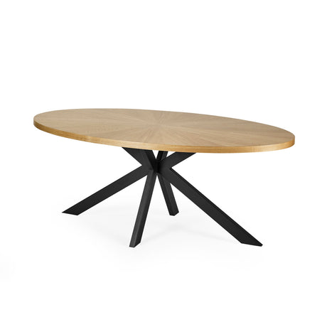 Oval light wood dining table angled view showing fine wood grain and black metal crossed legs