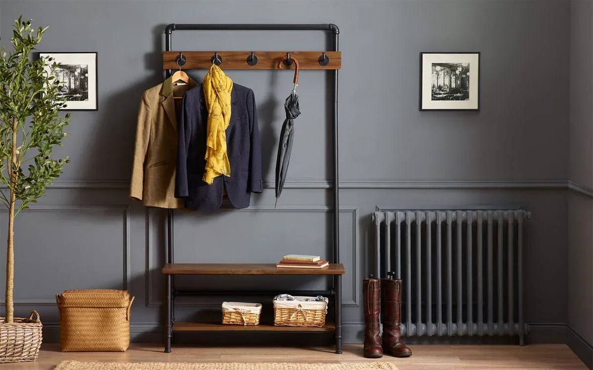 Industrial hall stand with coat hooks, wooden shelves and storage baskets in entryway