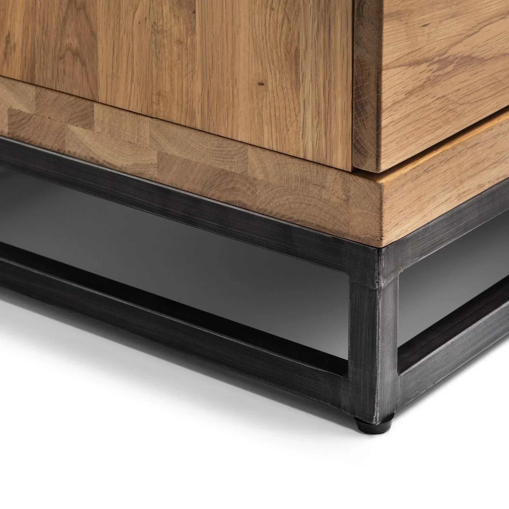 Oak TV unit detail showing wood grain and black metal base
