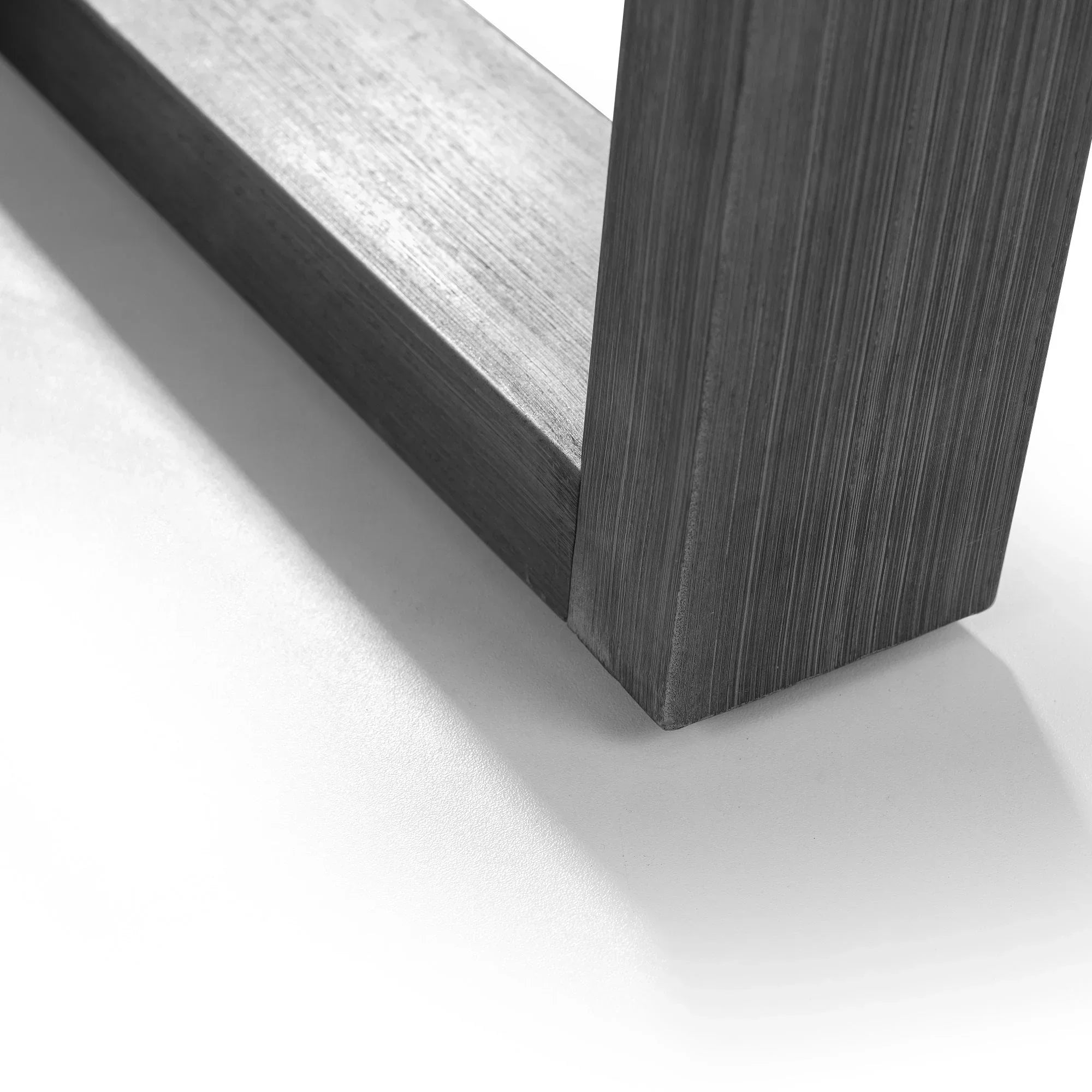 Close-up of oak dining table leg showing wood grain and natural finish