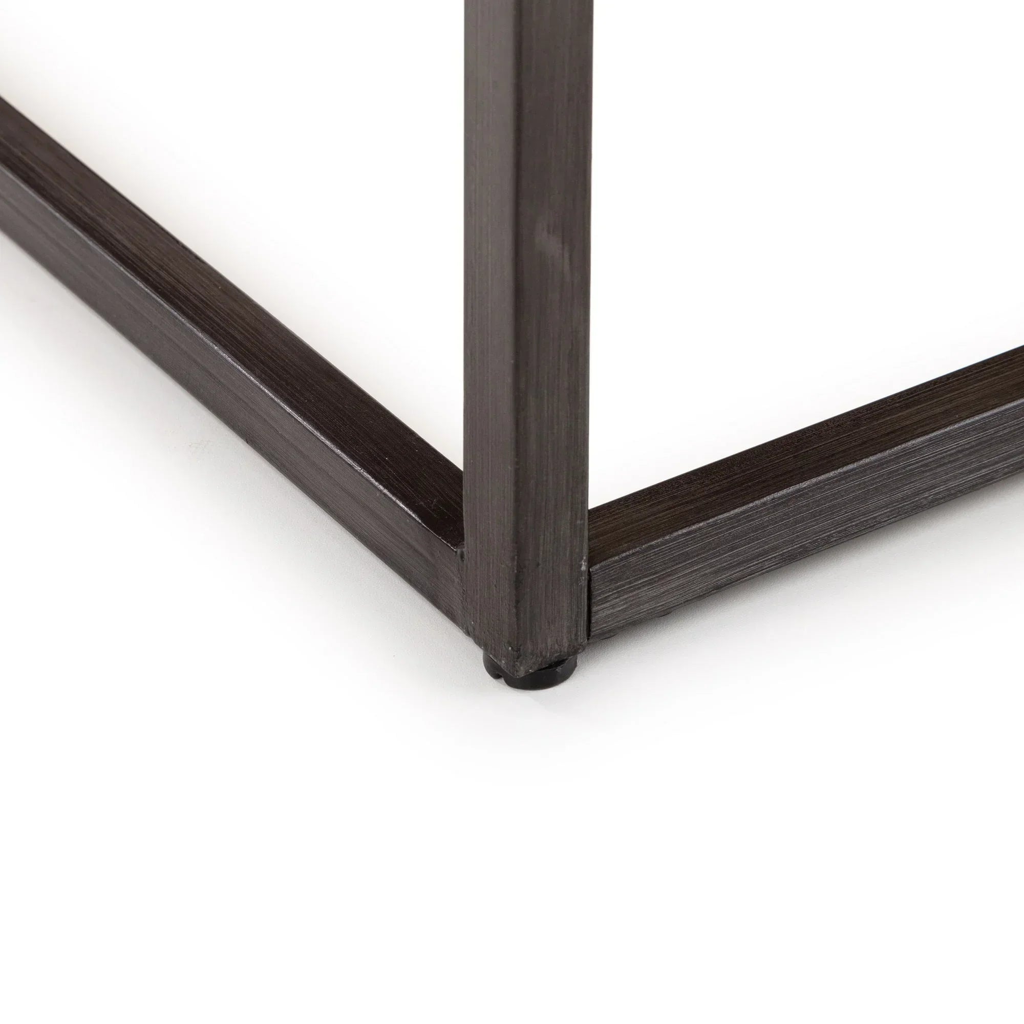 Dark oak coffee table leg and metal frame corner detail