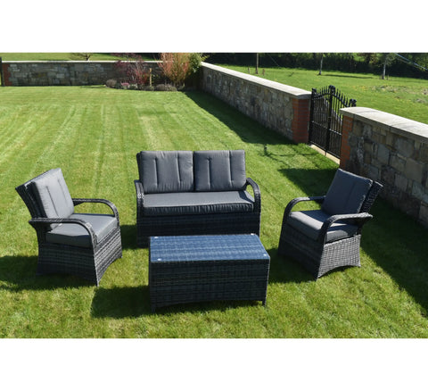 Grey rattan outdoor sofa set with cushioned chairs and coffee table on lawn