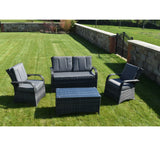 Grey rattan outdoor sofa set with cushioned chairs and coffee table on lawn