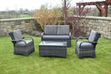 Grey rattan Barcelona sofa set with cushions and glass table on garden lawn