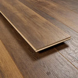 Barnwood oak laminate flooring plank with realistic wood grain and brown finish
