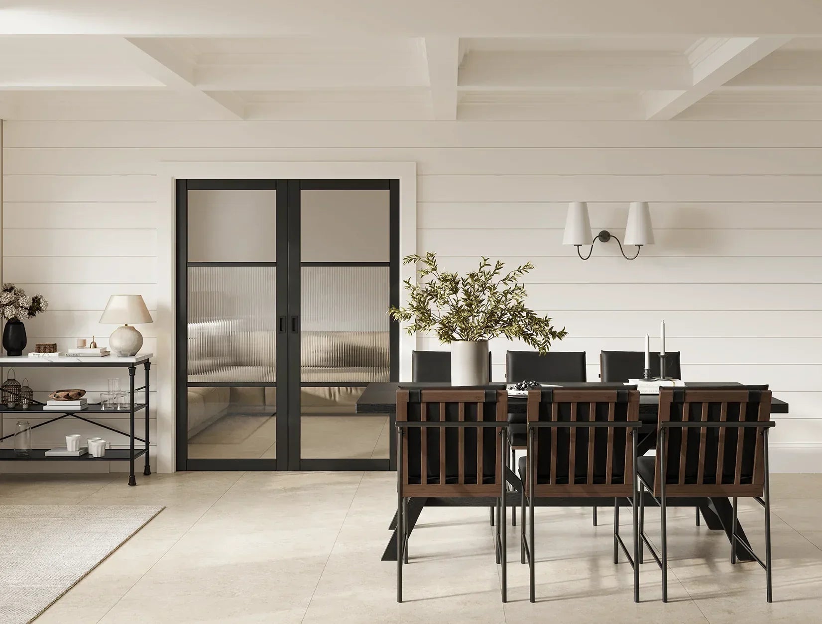 Black Sutton reeded glazed double doors in modern dining room with wooden table and chairs