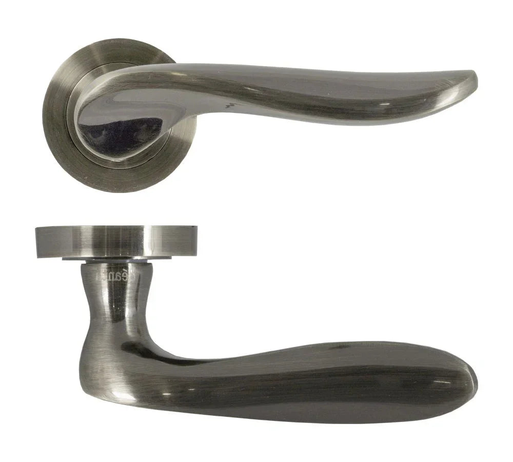 Brushed nickel door handle set with curved lever design on round rose