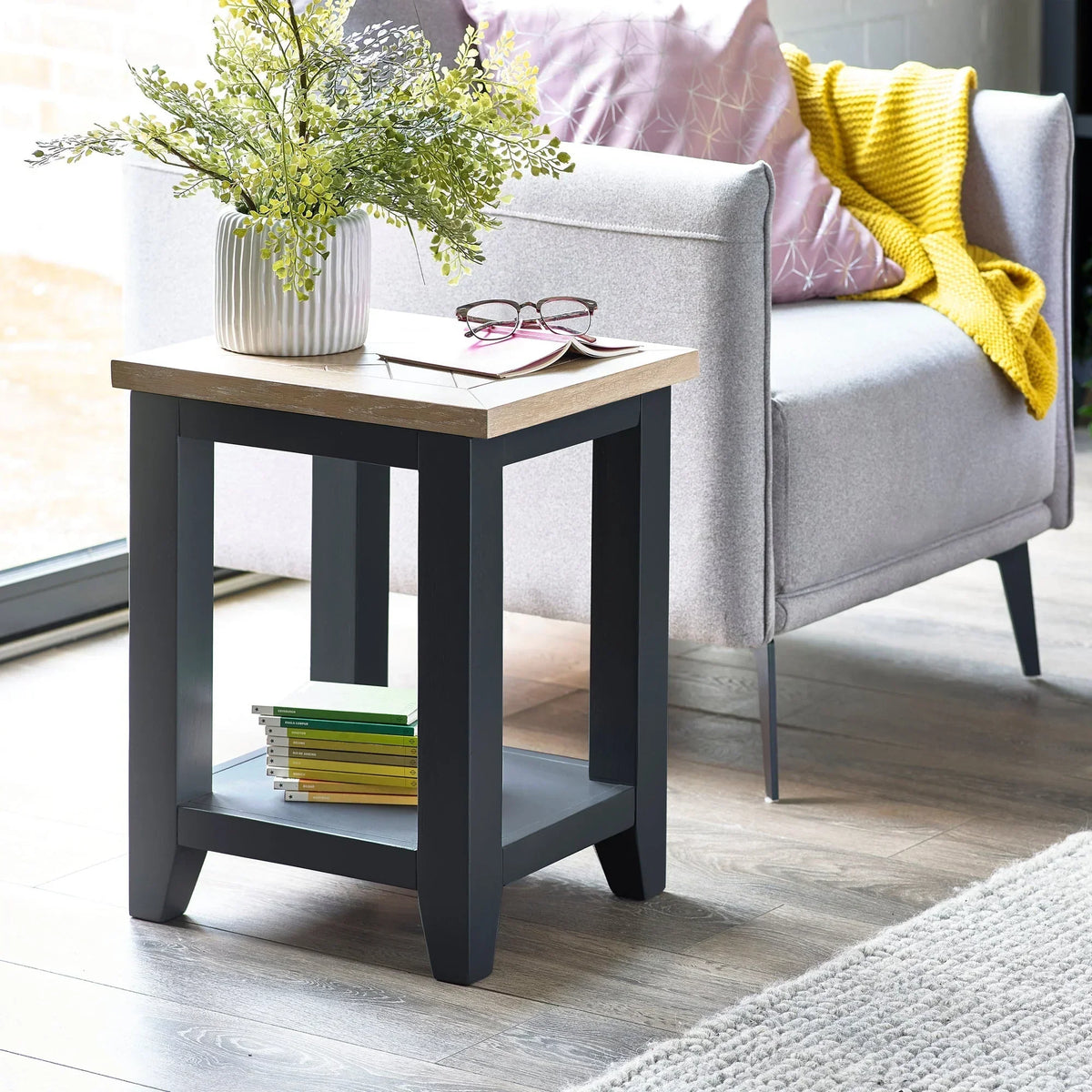 Bordeaux lamp table with oak top and grey legs beside sofa in modern living room