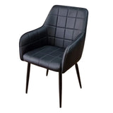 Black dining chair with armrests, quilted upholstery and slim metal legs
