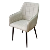 Taupe accent chair with quilted upholstery and black legs, angled front view